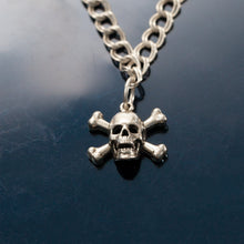 Load image into Gallery viewer, Skull and Cross bone charm on o ring - Sterling Silver - Pirate Jewelry