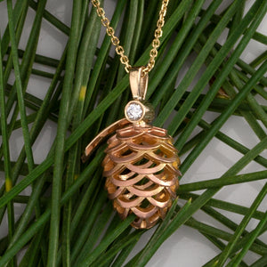 rose gold and yellow gold pine cone necklace with diamond nature inspired jewelry