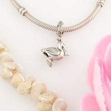 Load image into Gallery viewer, Pelican charm on coral spacer - pelican jewelry - beach charms
